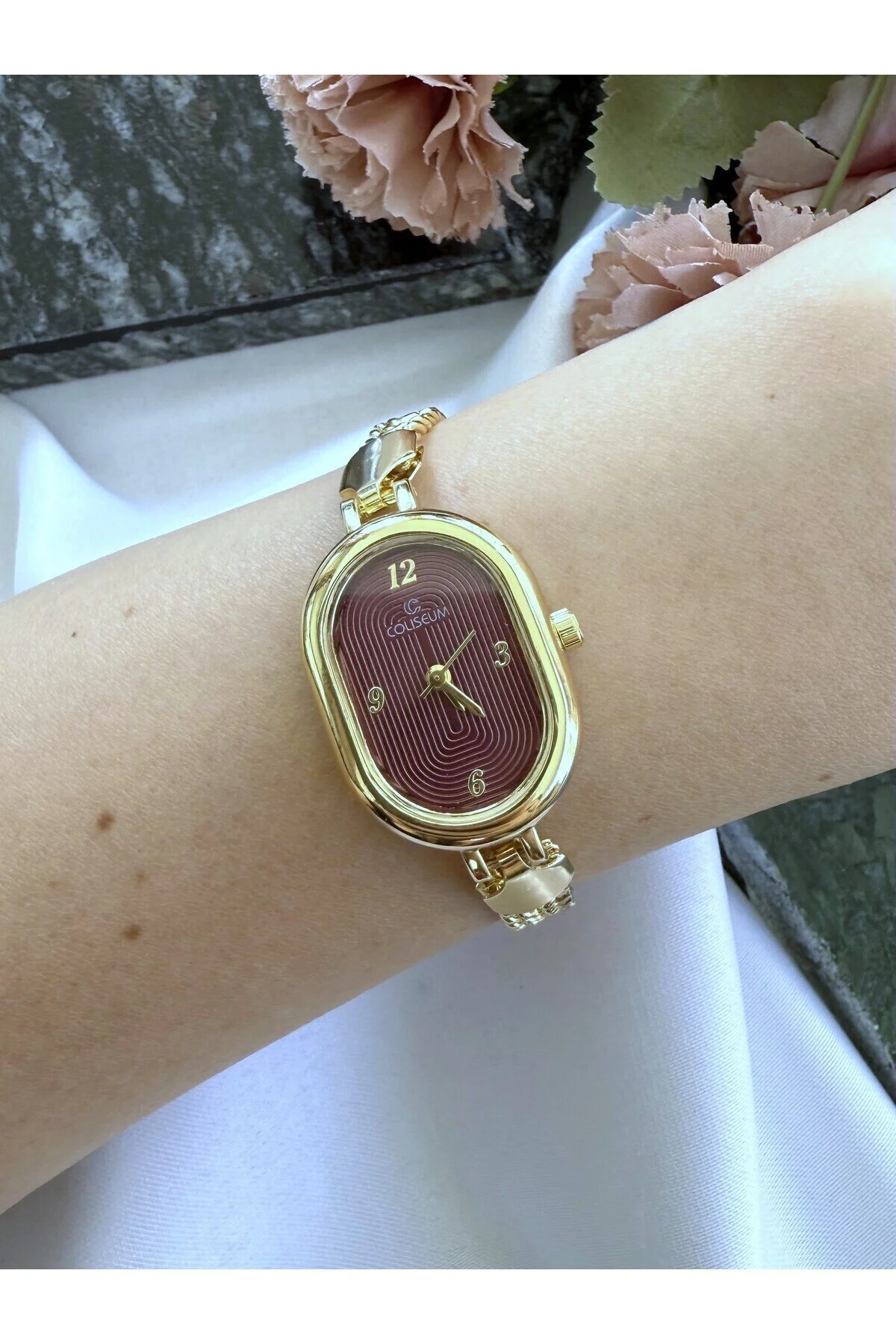ساعت مچی زنانه طلایی بیضی رنگ داخلی CLARET RED Mazzy
