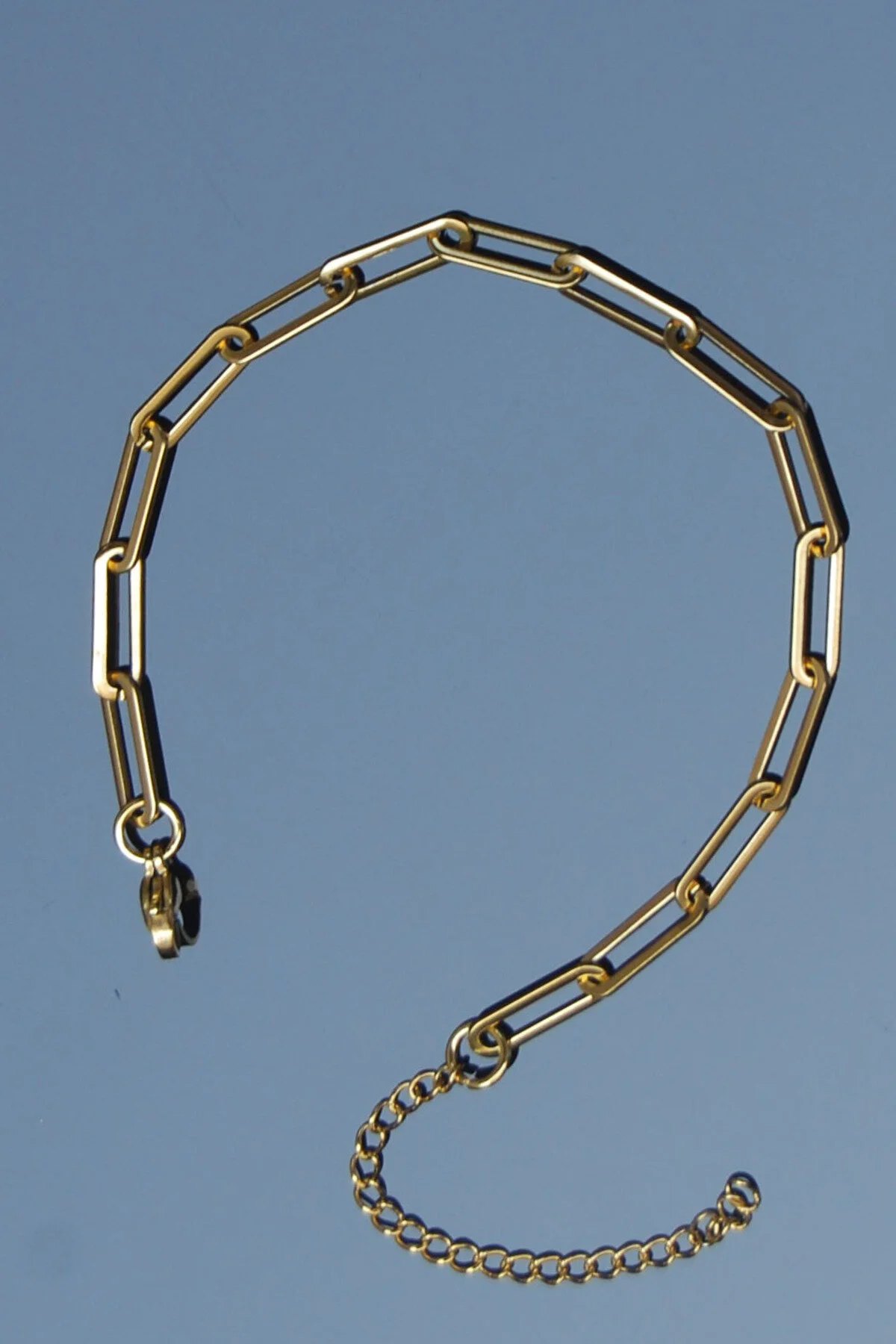 دستبند فولادی زنجیر گیره ای استیل 5 میلی متری رنگ طلایی | ضد لکه یونیسکس 2 سال گارانتی Rua Jewelry
