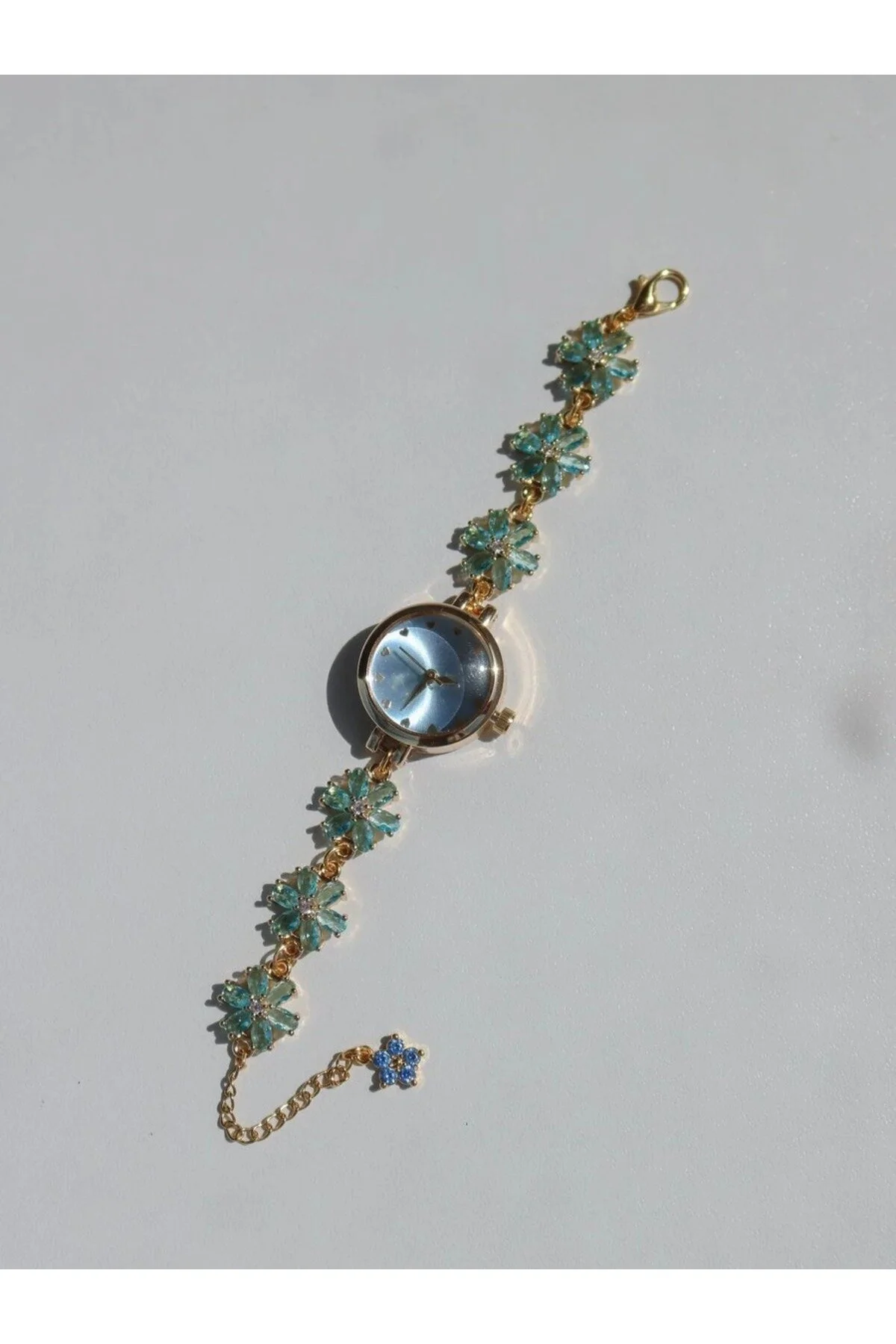 ساعت زنانه درخشش گل گلدار سنگ زیرکون آبی Reorah Collection
