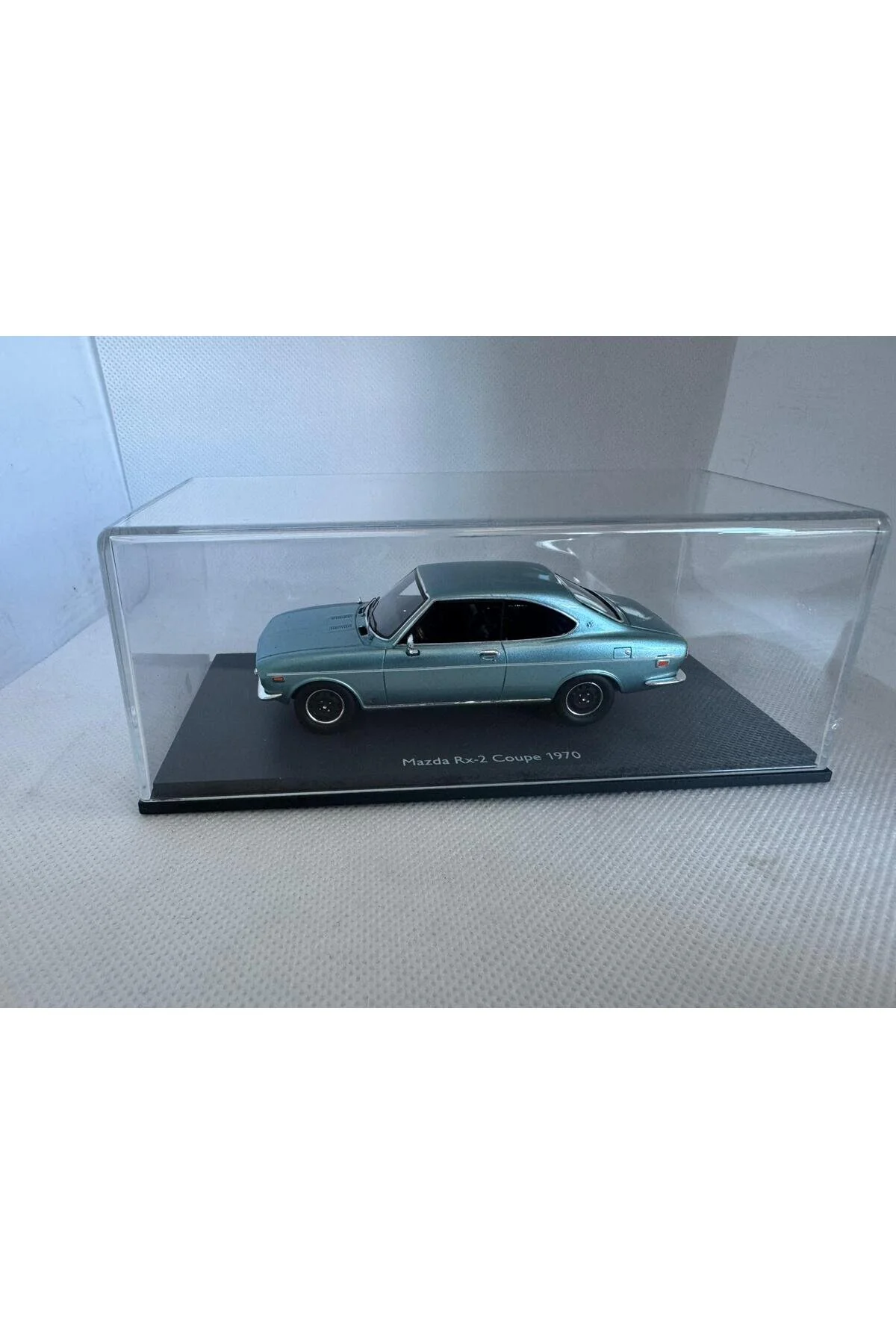 مدل خودرو 1:43 MAZDA RX 2 COUPÉ 1970 LIGHT BLUE METALIC 43U00096 | ماشین ریخته گری Schuco